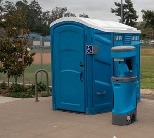 Ada Compliant porta potty near a baseball field 